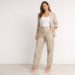 Woman wearing cargo pants styled with blazer and heels in a chic minimalist outfit.