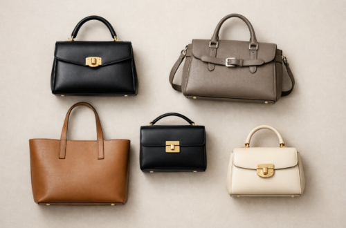 Flat lay of different structured handbag types including a top-handle bag, satchel, structured tote, box bag, and mini top-handle bag arranged on a neutral background.